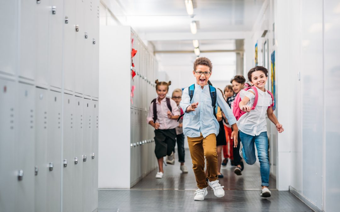 cute funny kids running through school corridor