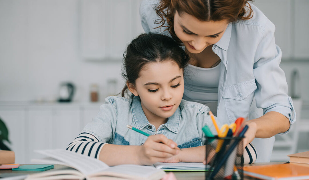 Mom helping daughter with school work