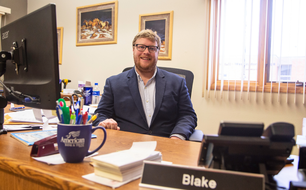 Blake Willman sitting at his desk