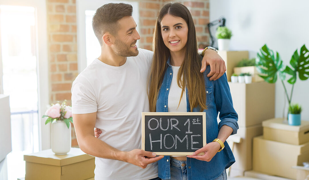 couple holding sign