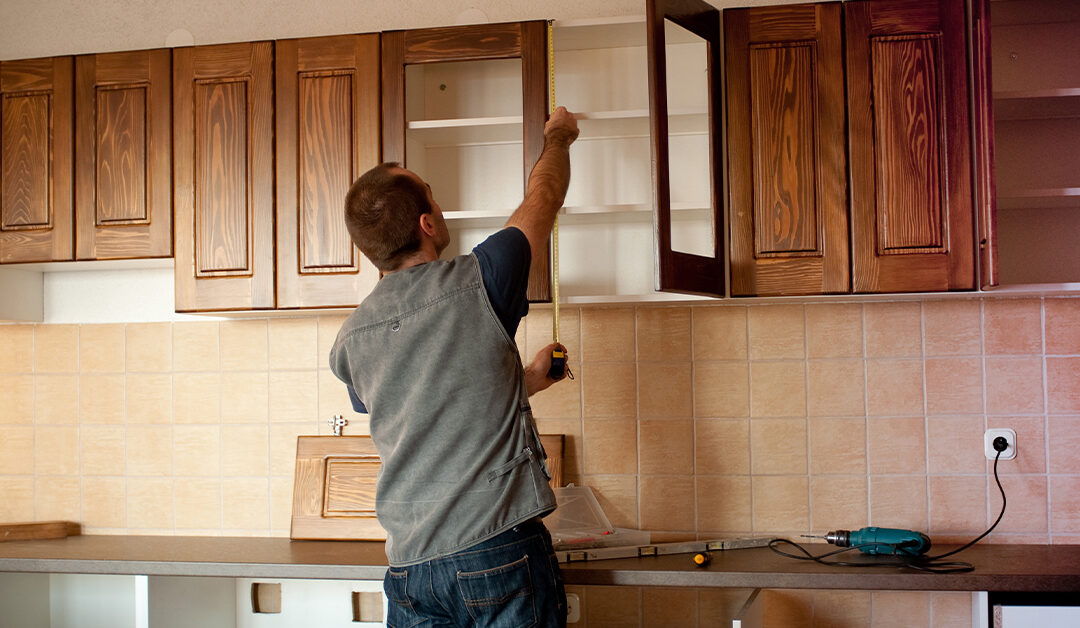 man building cabinets