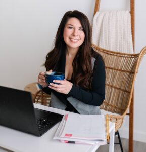 Cassi Beech sitting at her desk