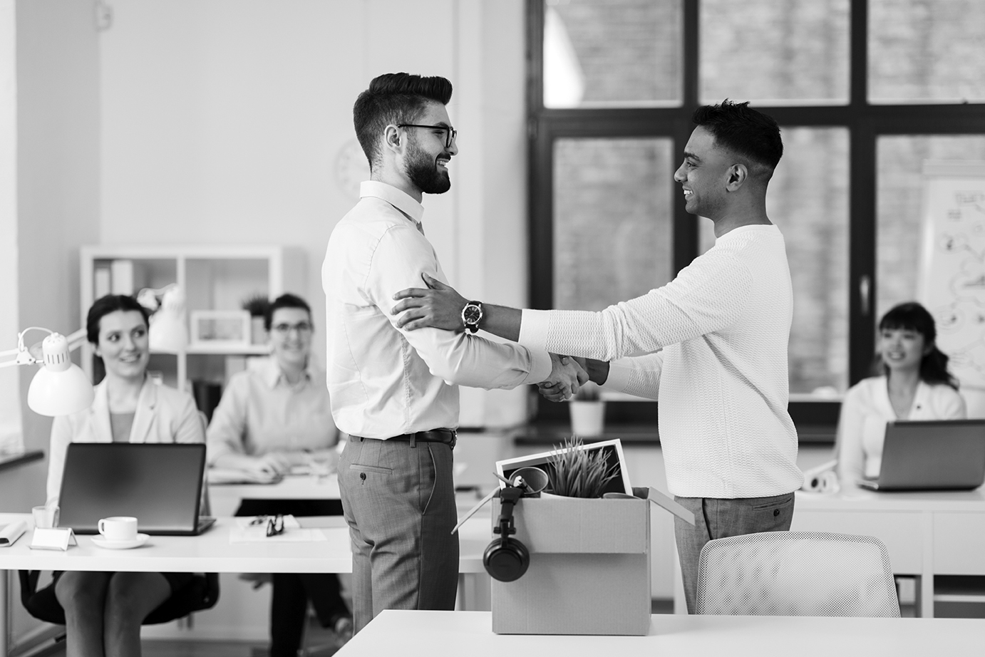 new male employee meeting colleagues at office